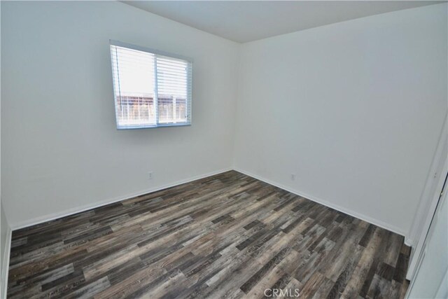 31105 Sunningdale Dr, Temecula, CA 92591 - empty room featuring dark wood-style floors and baseboards