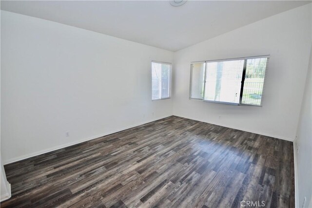 31105 Sunningdale Dr, Temecula, CA 92591 - empty room with dark wood-type flooring, healthy amount of natural light, and lofted ceiling