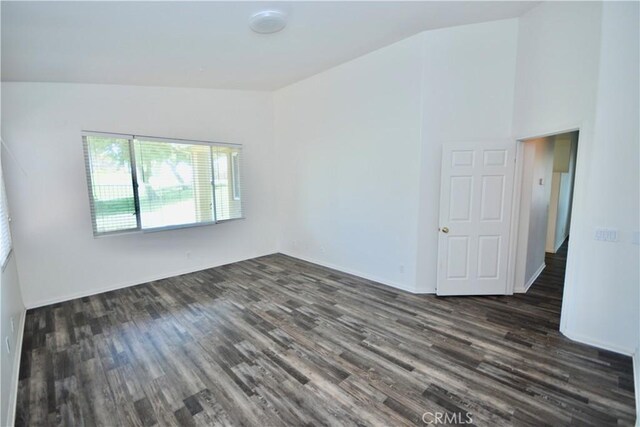 31105 Sunningdale Dr, Temecula, CA 92591 - unfurnished room with dark wood-type flooring, lofted ceiling, and baseboards