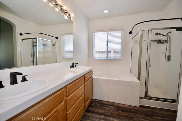 31105 Sunningdale Dr, Temecula, CA 92591 - full bathroom featuring a stall shower, a bath, double vanity, and wood finished floors