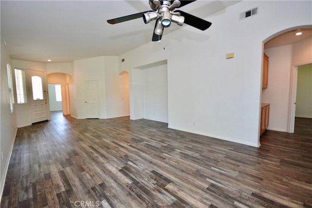 31105 Sunningdale Dr, Temecula, CA 92591 - unfurnished living room featuring ceiling fan, dark wood-style floors, arched walkways, recessed lighting, and baseboards