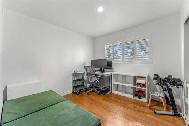 office space with recessed lighting, baseboards, and wood finished floors