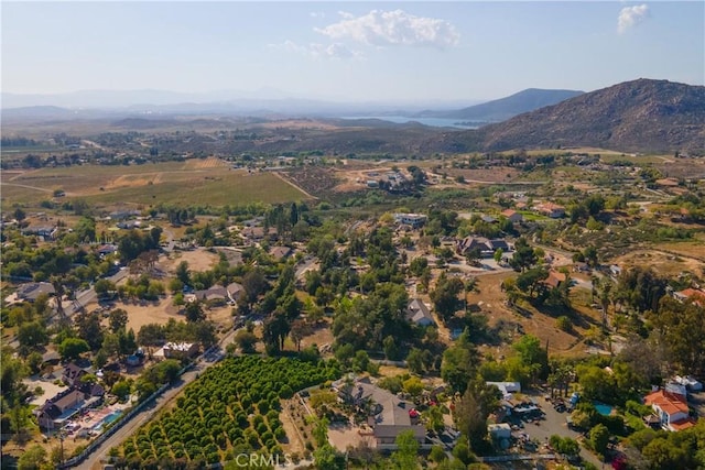 birds eye view of property featuring a mountain view
