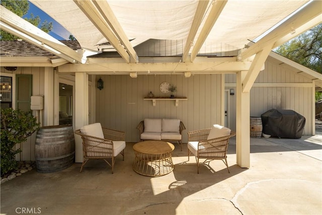 view of patio with grilling area and an outdoor living space