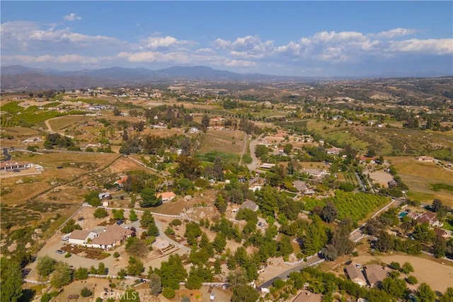 birds eye view of property featuring a mountain view