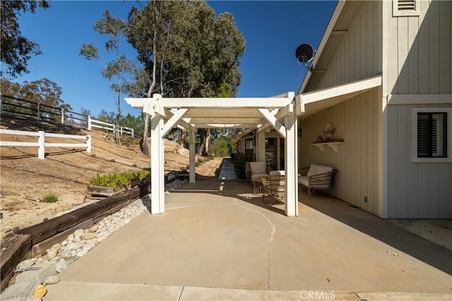 view of patio featuring fence