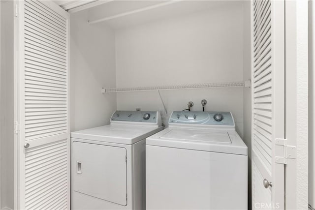19116 Queensport Ln Unit B, Huntington Beach, CA 92646 - laundry area with washing machine and clothes dryer and laundry area