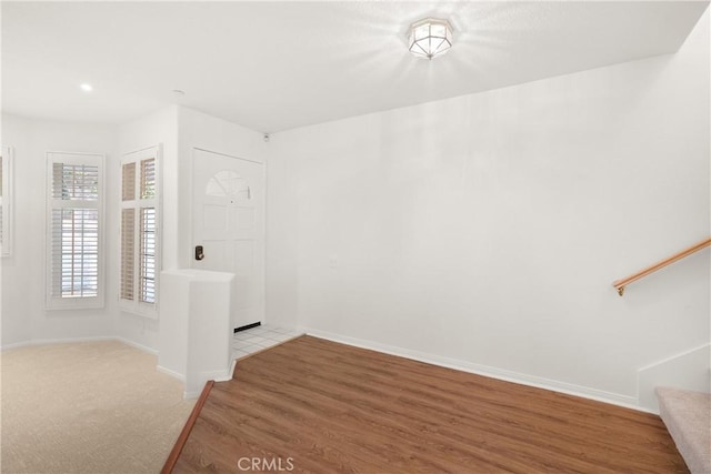 entrance foyer with baseboards, recessed lighting, light wood-style floors, and stairway