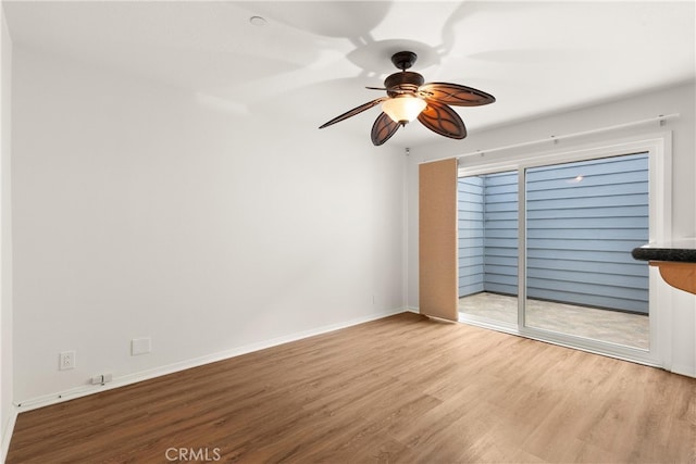 19116 Queensport Ln Unit B, Huntington Beach, CA 92646 - empty room featuring baseboards, a ceiling fan, and wood finished floors