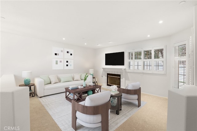 19116 Queensport Ln Unit B, Huntington Beach, CA 92646 - living room with recessed lighting, baseboards, light carpet, and a tiled fireplace