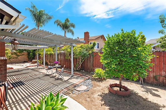 view of patio / terrace featuring a pergola and a fenced backyard