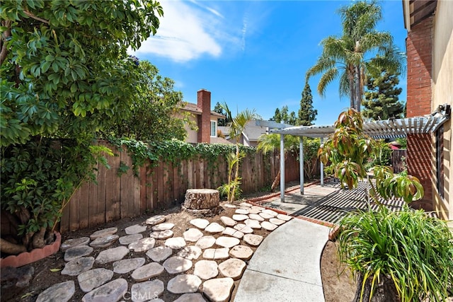 view of patio / terrace with a fenced backyard and a pergola