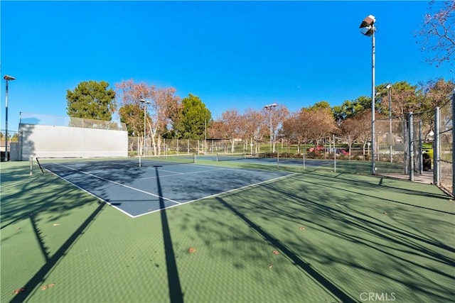 view of sport court featuring fence and community basketball court