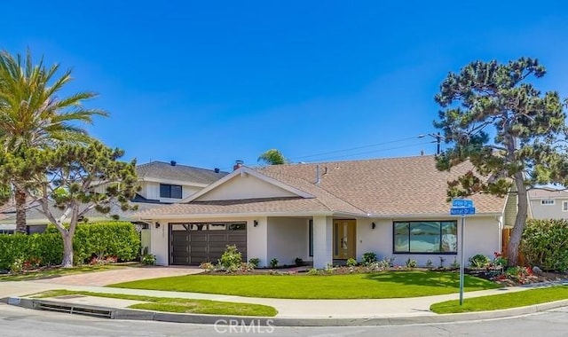 2027 Kornat Dr, Costa Mesa, CA 92626 - view of front of property with stucco siding, a garage, a front yard, concrete driveway, and roof with shingles