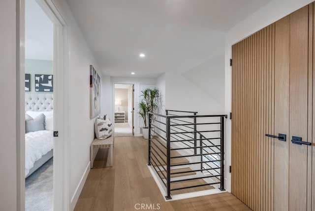 2027 Kornat Dr, Costa Mesa, CA 92626 - hall with an upstairs landing, wood finished floors, and recessed lighting