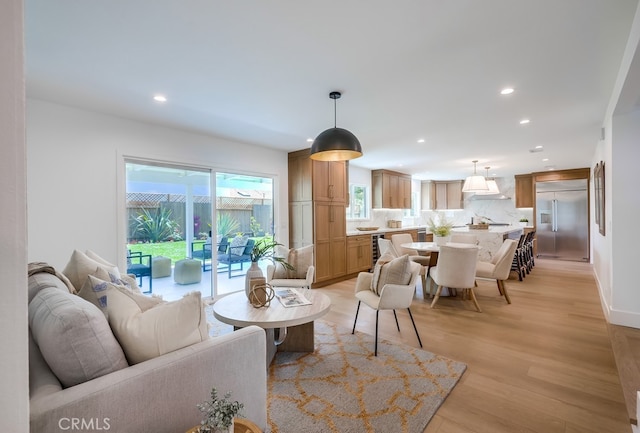 2027 Kornat Dr, Costa Mesa, CA 92626 - living room featuring recessed lighting, light wood-style flooring, and baseboards