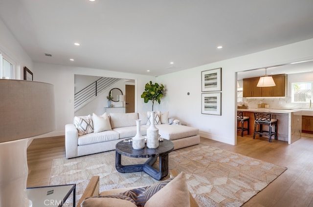 2027 Kornat Dr, Costa Mesa, CA 92626 - living room featuring light wood finished floors, recessed lighting, and stairs