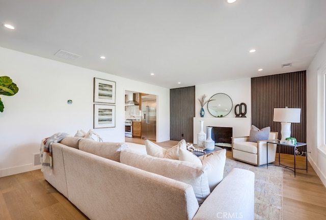2027 Kornat Dr, Costa Mesa, CA 92626 - living room featuring recessed lighting, light wood finished floors, and baseboards