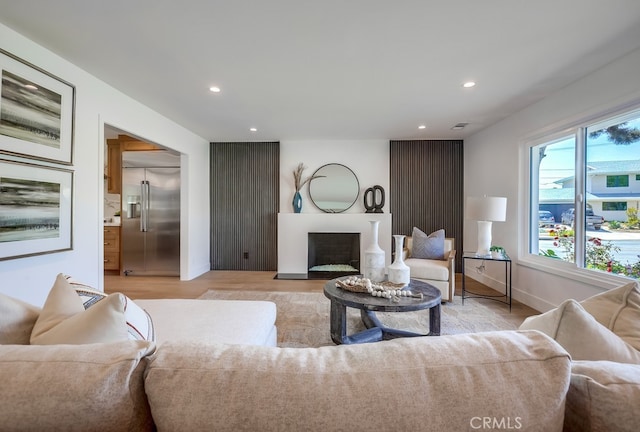 2027 Kornat Dr, Costa Mesa, CA 92626 - living room with baseboards, light wood-style floors, recessed lighting, and a fireplace