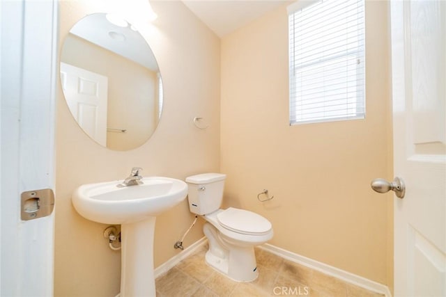 32674 Clearvail Dr, Temecula, CA 92592 - half bathroom featuring toilet, tile patterned flooring, baseboards, and a sink