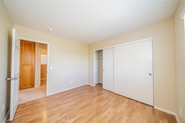32674 Clearvail Dr, Temecula, CA 92592 - unfurnished bedroom featuring light wood-style flooring, a closet, and baseboards