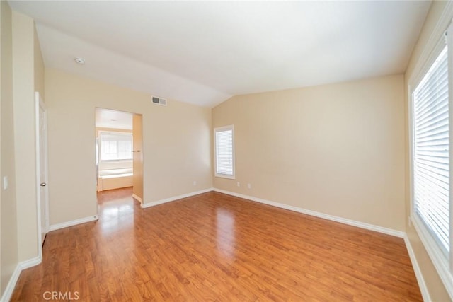 32674 Clearvail Dr, Temecula, CA 92592 - spare room featuring light wood finished floors, healthy amount of natural light, baseboards, and vaulted ceiling