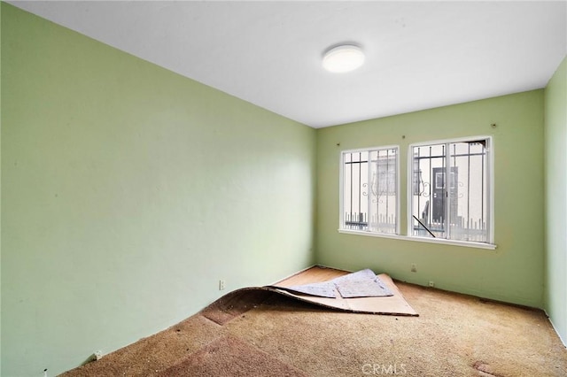 empty room featuring carpet flooring