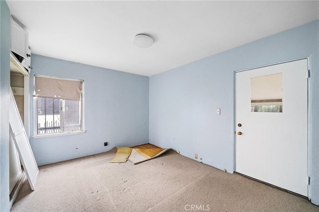 unfurnished room with carpet flooring