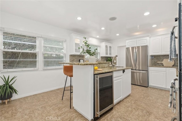 8163 Billowvista Dr, Playa Del Rey, CA 90293 - kitchen featuring beverage cooler, freestanding refrigerator, a sink, and decorative backsplash