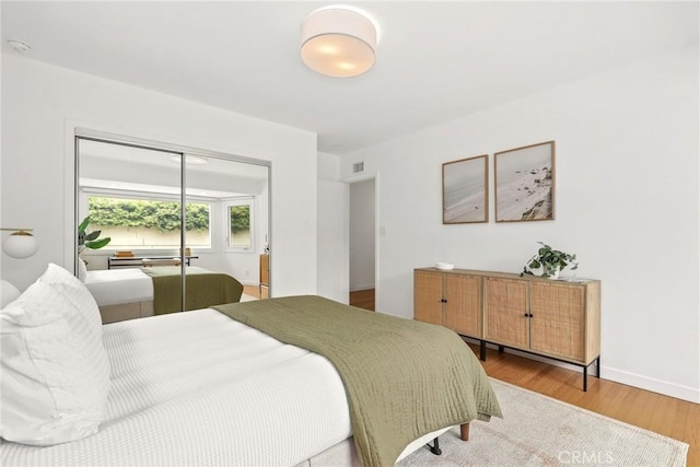 8163 Billowvista Dr, Playa Del Rey, CA 90293 - bedroom featuring baseboards, visible vents, wood finished floors, and a closet