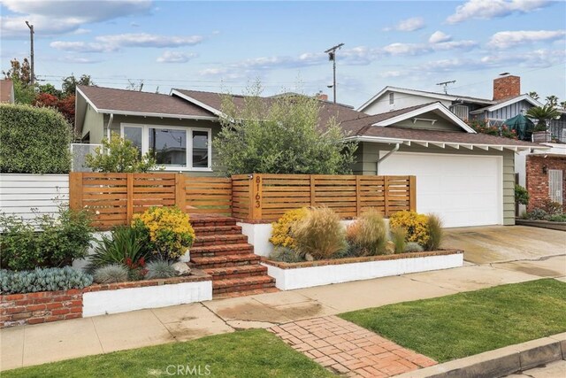 8163 Billowvista Dr, Playa Del Rey, CA 90293 - view of front of house with concrete driveway, an attached garage, fence private yard, and roof with shingles