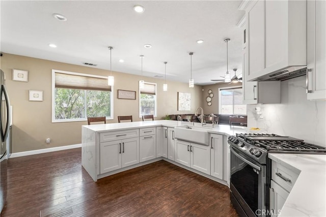 kitchen with visible vents, a sink, stainless steel appliances, recessed lighting, and a wealth of natural light