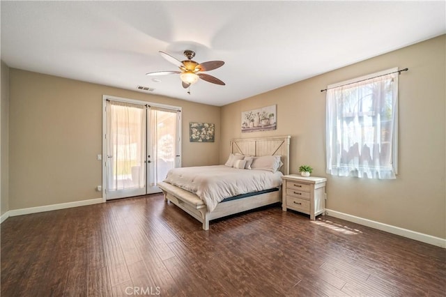 bedroom featuring baseboards, access to outside, dark wood-type flooring, and visible vents