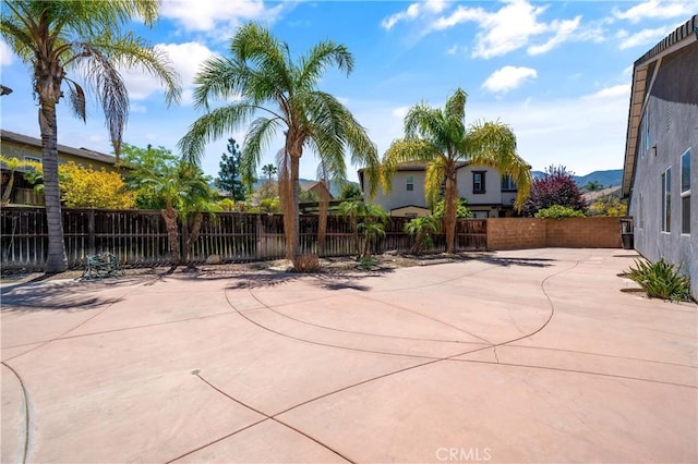 view of patio / terrace featuring fence