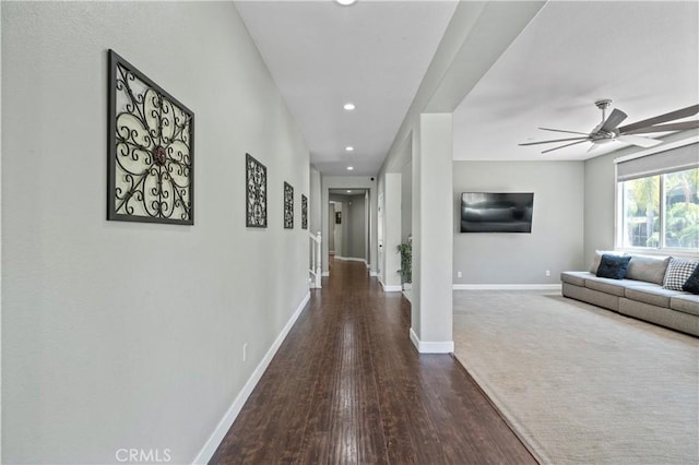 hall featuring recessed lighting, baseboards, and wood finished floors