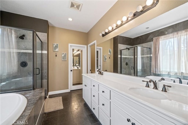 full bathroom with double vanity, a shower stall, a sink, and a bath