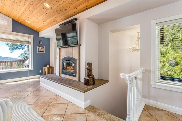 6377 Sugar Pines Cir, Angelus Oaks, CA 92305 - living area with tile patterned floors, plenty of natural light, a tile fireplace, a chandelier, and wooden ceiling