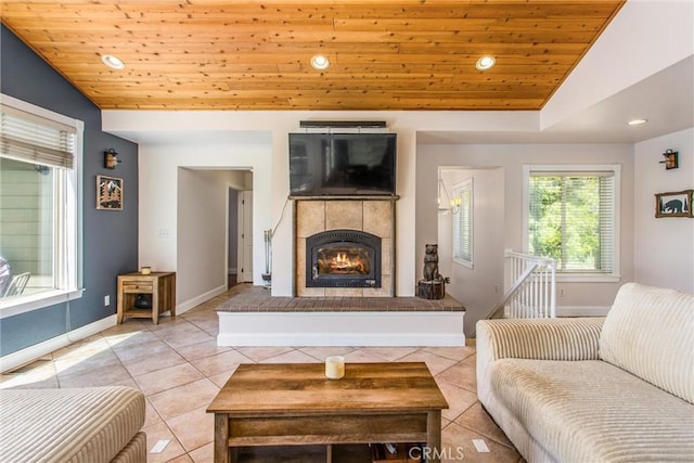6377 Sugar Pines Cir, Angelus Oaks, CA 92305 - living room with lofted ceiling, wood ceiling, recessed lighting, light tile patterned floors, and baseboards