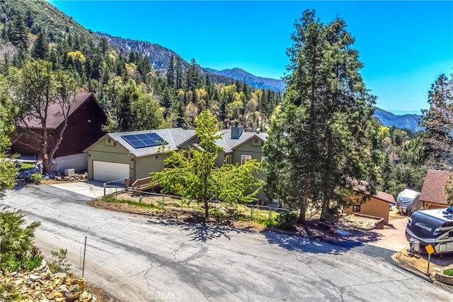 6377 Sugar Pines Cir, Angelus Oaks, CA 92305 - view of mountain backdrop featuring a forest