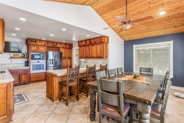 6377 Sugar Pines Cir, Angelus Oaks, CA 92305 - dining space with recessed lighting, light tile patterned flooring, wood ceiling, ceiling fan, and high vaulted ceiling