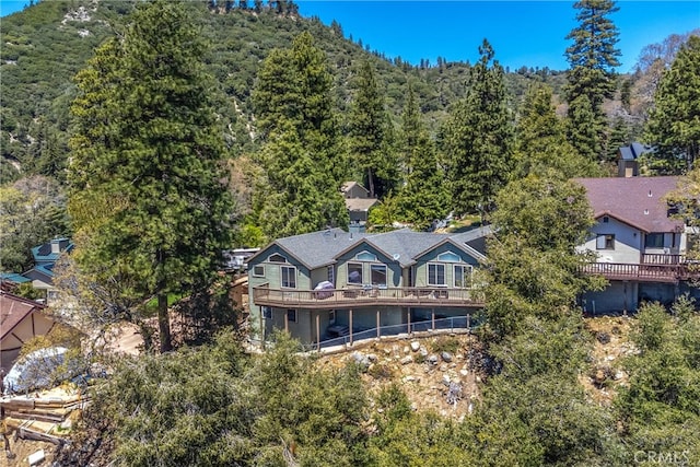 6377 Sugar Pines Cir, Angelus Oaks, CA 92305 - aerial view of property and surrounding area featuring a forest and a mountain backdrop