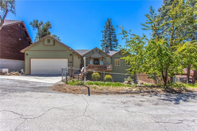 6377 Sugar Pines Cir, Angelus Oaks, CA 92305 - view of front facade with fence, a garage, and concrete driveway
