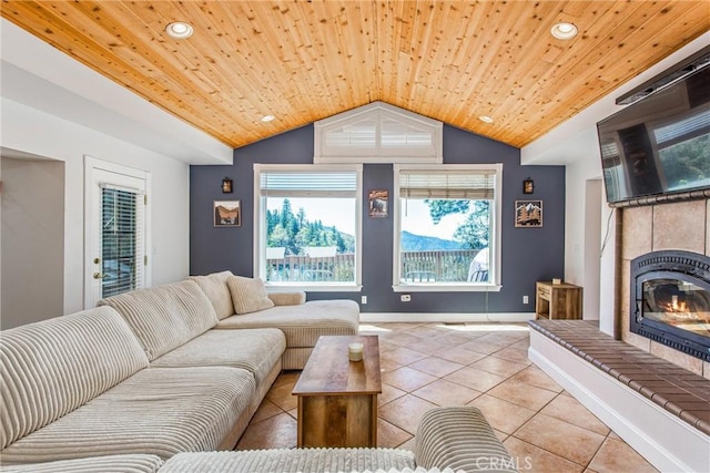 6377 Sugar Pines Cir, Angelus Oaks, CA 92305 - living room featuring light tile patterned floors, vaulted ceiling, wood ceiling, recessed lighting, and a glass covered fireplace