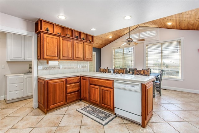 6377 Sugar Pines Cir, Angelus Oaks, CA 92305 - kitchen with dishwasher, a sink, vaulted ceiling, ceiling fan, and light tile patterned flooring