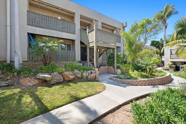 view of home's community featuring stairway