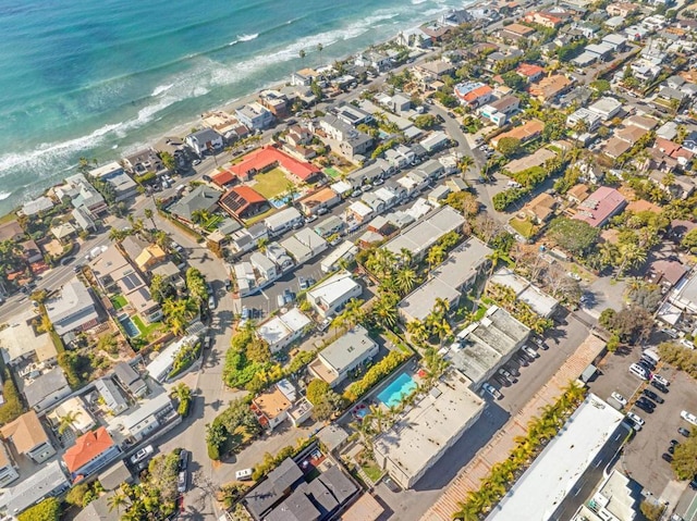 aerial view featuring a view of the beach and a water view