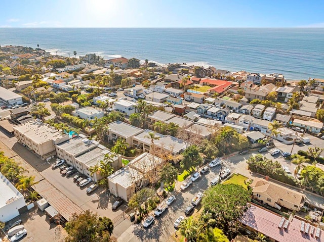 drone / aerial view with a water view and a residential view