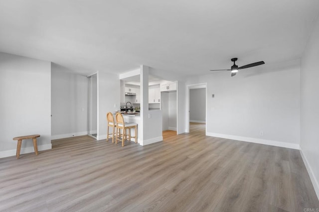 149 W Glaucus St Unit D, Encinitas, CA 92024 - unfurnished living room with light wood finished floors and a ceiling fan