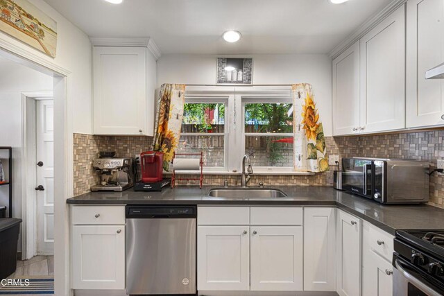 1318 N Marengo Ave, Pasadena, CA 91103 - kitchen with appliances with stainless steel finishes, a sink, white cabinetry, backsplash, and dark countertops