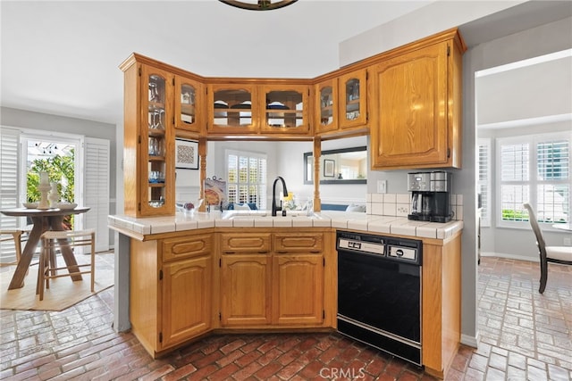 3 Treethorne Cir, Laguna Niguel, CA 92677 - kitchen with a sink, brick floor, black dishwasher, and glass insert cabinets